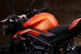 A small TFT display with Bluetooth connectivity is also part of the package Triumph Street Triple R in orange tank shot